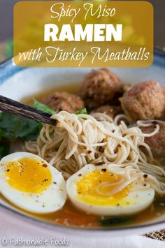 a bowl of ramen with turkey meatballs and an egg on top, in front of the words spicy miso ramen with turkey meatballs