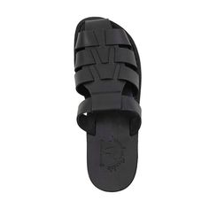 The Michael Pacific Slide is a stylish sandal-inspired footwear in Black full-grain leather, which is perfect for adding flair and comfort to your wardrobe. Premium top-quality leather offers exceptional comfort and durability. The unique leather upper sole molds to your feet for a personalized fit, and the robust polyurethane outsole ensures all-day wear. Enjoy these closed-toe sandals in any environment, from city to beach. Handcrafted in East Jerusalem using 100% natural leather, the Michael Casual Leather Slides With Textured Sole, Leather Sandals With Rubber Sole, Leather Closed Toe Sandals With Rubber Sole, Black Open Toe Sandals With Rubber Sole, Leather Closed Toe Sandals With Textured Sole, Leather Sandals With Rubber Sole And Single Toe Strap, Leather Sandals With Single Toe Strap And Rubber Sole, Black Flat Sandals With Rubber Sole, Casual Leather Slides With Open Heel