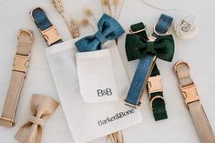 the bow tie and other accessories are laid out next to each other on a white surface