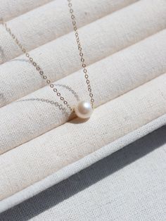 Experience timeless elegance with our 14K Gold Filled Natural Freshwater Pearl Pendant Necklace - a luxurious accessory combining the beauty of pearls and gold. Metal: 14K Gold Filled Gemstone: Pearl Pearl: Freshwater Pearl（8.5-9mm) Necklace length: 440mm Weight: 1.7g Necklace Pearl, Charm Pendant Necklace, Pearl Pendant Necklace, Necklace Length, Pearl Pendant, Stone Necklace, Ring Bracelet, Stone Rings, Charm Pendant