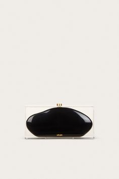 Taking a nod from 60’s mod glamour, the Annika Clutch is designed as a black curved clutch inside of a translucent box. The clear acrylic outside offers a very retro-inspired feel, and the black abstract-shaped middle casing creates a stark contrast. From weekend travels, to parties and galas — she’s sure to be an artful addition to any outing. Chic Black Clutch With Rectangular Case, Black Rectangular Clutch For Formal Occasions, Classic Black Clutch For Party, Chic Black Rectangular Clutch, Elegant Black Rectangular Clutch, Modern Evening Clutch With Rectangular Case, Black Rectangular Clutch For Parties, Modern Black Clutch For Evening, Modern Black Clutch For Formal Occasions