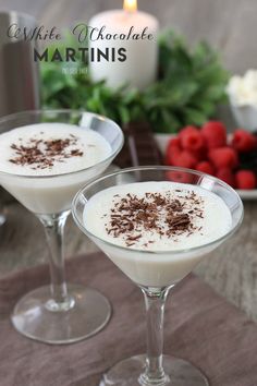 two martini glasses filled with white chocolate and garnished with sprinkles