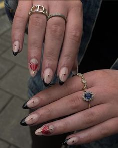 two hands with manies and rings on them