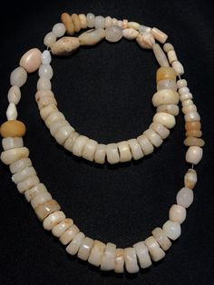 A collection of natural excavated white agate beads from ancient period as seen on its surface the patina. The holes are large and can be formed into a beautiful necklace or can be made in I individual pendants. All beads are in great condition and natural shaped Rondelle Natural Stones Beads For Jewelry Making, Large Rondelle Beads For Jewelry Making, Rondelle Large Beads Necklace For Jewelry Making, Rondelle Beaded Necklaces With Large Beads For Jewelry Making, Artisan Rondelle Polished Beads, Handmade Vintage Agate Beads, Gems, And Cabochons, Spiritual Brown Beads, Gems, And Cabochons With Natural Stones, Carnelian Necklace, Crystal Bead Necklace