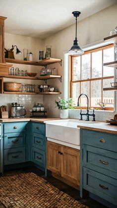 a kitchen with blue cabinets and wooden shelves