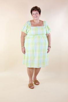 Introducing our Spring Serenity Dress, a vision of elegance and charm! Embrace its whimsical allure with balloon sleeves, a square neckline, and vibrant hues of green, blue, and yellow. Available in sizes small to 3XL, and fully lined for your comfort. Model: Abby is wearing a size large. Size Suggestions and Measurements: Small: 2-6 | Bust: 14 inches across the front | Length: 36 inches Medium: 8-10 | Bust: 14 inches across the front | Length: 37 inches Large: 12-14 | Bust: 15 inches across the Green Fitted Puff Sleeve Dress For Garden Party, Fitted Green Puff Sleeve Dress For Garden Party, Green Square Neck Puff Sleeve Dress For Spring, Green Square Neck Dress For Brunch, Green Puff Sleeve Dress For Garden Party, Green Puff Sleeve Dress With Gathered Sleeves, Green Knee-length Puff Sleeve Summer Dress, Green Puff Sleeve Knee-length Dress For Summer, Green Puff Sleeve Dress With Gathered Balloon Sleeves