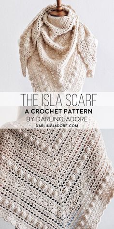 a crocheted shawl with text overlay that reads, the is a scarf a crochet pattern by darning jadore