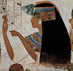 an ancient egyptian painting with two women and one is holding a bird in her hand