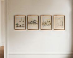 three framed pictures hang on the wall above a bed in a room with white walls