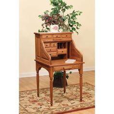 a wooden desk with a potted plant on top