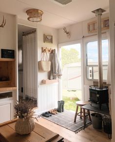 styled home with mini wood stove Cubic Mini Wood Stove, Small Wood Stove, Rv Interior Remodel, Camper Interior Design, Tiny Living Space, Diy Camper Remodel, Rv Homes, Rv Makeover, Trailer Living