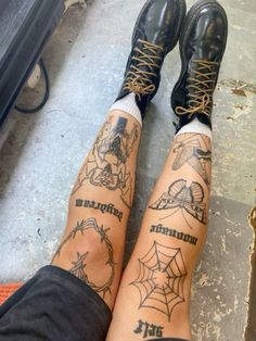 the legs and ankles of a person with tattoos on them