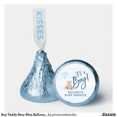 a blue foil wrapped herss candy with a baby present tag on it