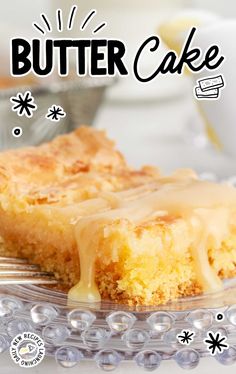 a piece of butter cake sitting on top of a glass plate