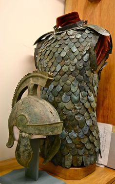 a helmet and armor on display in a museum