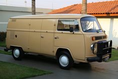 an old van is parked in front of a house