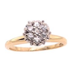 a diamond cluster ring in yellow gold