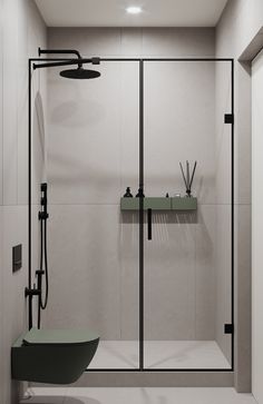 a bathroom with a glass shower door and black fixtures