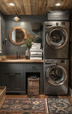 a washer and dryer in a bathroom with wood floors, walls and ceiling