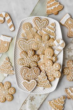 gingerbread cut out cookies on a white platter