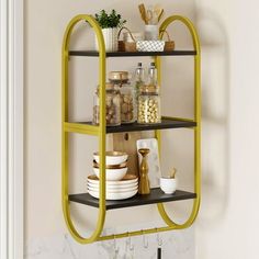 a yellow shelf with dishes on it in a kitchen next to a white wall and door