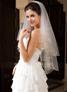 a woman in a wedding dress and veil posing for the camera on her instagram page