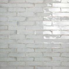 a white brick wall is shown in this image