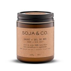 a jar of soy and co candle on a white background