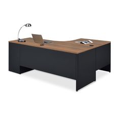 an office desk with a laptop on it