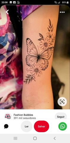 a woman's arm with a butterfly tattoo on it