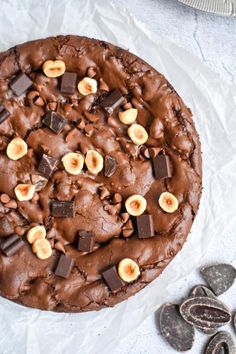 a chocolate cake topped with bananas and nuts