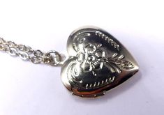 "Vintage gold tone and etched heart locket pendant necklace.In good vintage condition, It's 19\"½ long, Heart pendant 1\" x 3/4\". Thanks." Vintage Gold Heart Metal Necklace, Vintage Heart Charm Necklace Engraved, Gold Metal Locket Necklace With Vintage Charm, Vintage Gold-tone Jewelry For Valentine's Day, Vintage Metal Heart Locket Necklace, Gold Heart Pendant Locket Necklace With Hallmark, Gold Metal Locket Necklace For Wedding, Vintage Nickel-free Heart Pendant Necklace, Vintage Heart Pendant Locket Charm Necklace