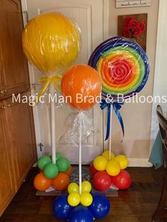 balloons and streamers are on the floor in front of a door