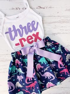 two - piece dinosaur outfit with matching skirt and headband