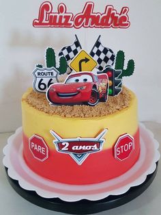 a birthday cake decorated with cars and signs