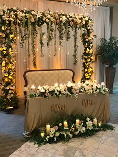 a table with candles and flowers on it