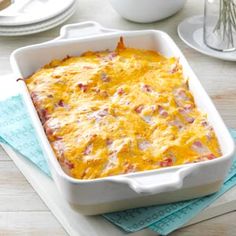 a casserole dish with ham and cheese