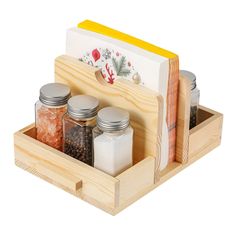 a wooden box with jars and spices in it