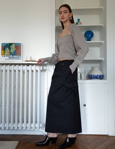 FINAL SALEChic black long parachute skirt with cargo zip pockets and drawstring waist tie. 70% cotton, 30% nylonElastic drawstring waist Side pocketsD ring detailingBack vent Size S waist adjustable, hips 37"/93 cmSize M waist adjustable , hips 39"/98 cmTotal length 36.5"/ 92.5 cmModel is wearing a size small and model's height is 5.9"/ 175 cm Cargo Skirt Outfit, Parachute Skirt, Grey Two Piece, Black Cargo, Cargo Skirt, Knit Set, Black Skirt, Playing Dress Up, Skirt Outfits