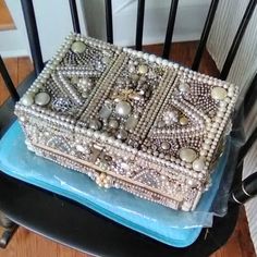 a decorative box sitting on top of a chair