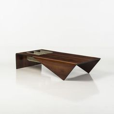 a wooden table sitting on top of a white floor