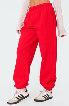 Love to lounge in these slouchy sweatpants crafted from a soft cotton blend with handy side pockets. Elastic waist Side-seam pockets Elastic cuffs 50% cotton, 50% polyester Machine wash, dry flat Imported Red Sweatpants Outfit, Sweatpants Oversized, Outfit Ideas Work, Tv Clothes, Red Sweatpants, Oversized Sweatpants, Sweatpants Outfit, Red Pants, Athletic Outfits