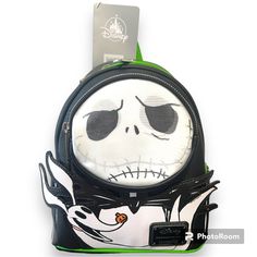 Loungefly The Nightmare Before Christmas Jack And Zero Mini Backpack Tim Burton's The Nightmare Before Christmas, This Simulated Leather Backpack Features Jack's Face On The Lenticular Round Zip Pocket On The Front, Which Includes His Loyal Ghost Dog Zero! Simulated Leather Backpack Round Front Pocket With Lenticular Artwork Of Jack Skellington's Face Watch His Expression Change As You Move The Bag Front Features Die-Cut Design Of Jack Skellington With 3d Elements Including His Bat Bowtie And Ze White Backpack For Halloween, White Halloween Backpack For Travel, Lenticular Artwork, Halloween White Backpack, White Halloween Backpack, White Halloween-themed Travel Backpack, Loungefly Bag Halloween, Jack And Zero, Horror Loungefly