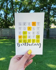 someone holding up a birthday card with the words great toasts and happy birthday written on it