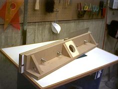 two sinks are sitting on top of a workbench