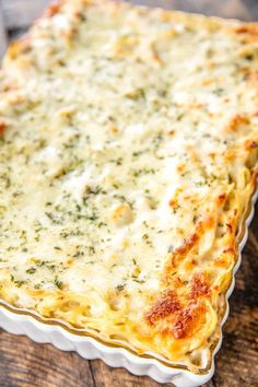 a cheesy casserole dish on a wooden table