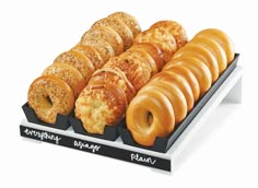 there are many different types of doughnuts on the display tray, including one with an omelet