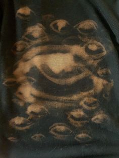 a man wearing a black t - shirt with an image of a tiger on it