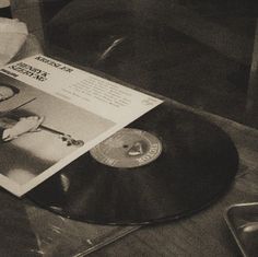 the record player is playing music on his turntable