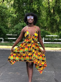 This kente Dress is gorgeous for the summer and very vibrant. Dress is halter style Has adjustable strings that tie to the neck and back Dress is high low style Material is light weight Very comfortable fit Strings can be tied at the shoulder or back Attention grabbing dress. Can be worn at the beach To parties and cook outs Fitted Multicolor Sundress With Tie Back, Fitted Multicolor Halter Dress For Beach Season, Yellow Tie Back Mini Dress For Beach, Yellow Halter Neck Dress For Summer, Yellow Sundress Halter Dress For Beach, Yellow Beach Sundress Halter Dress, Yellow Halter Sundress For Beach, Yellow Summer Halter Dress, Yellow Tie Back Mini Dress For Vacation